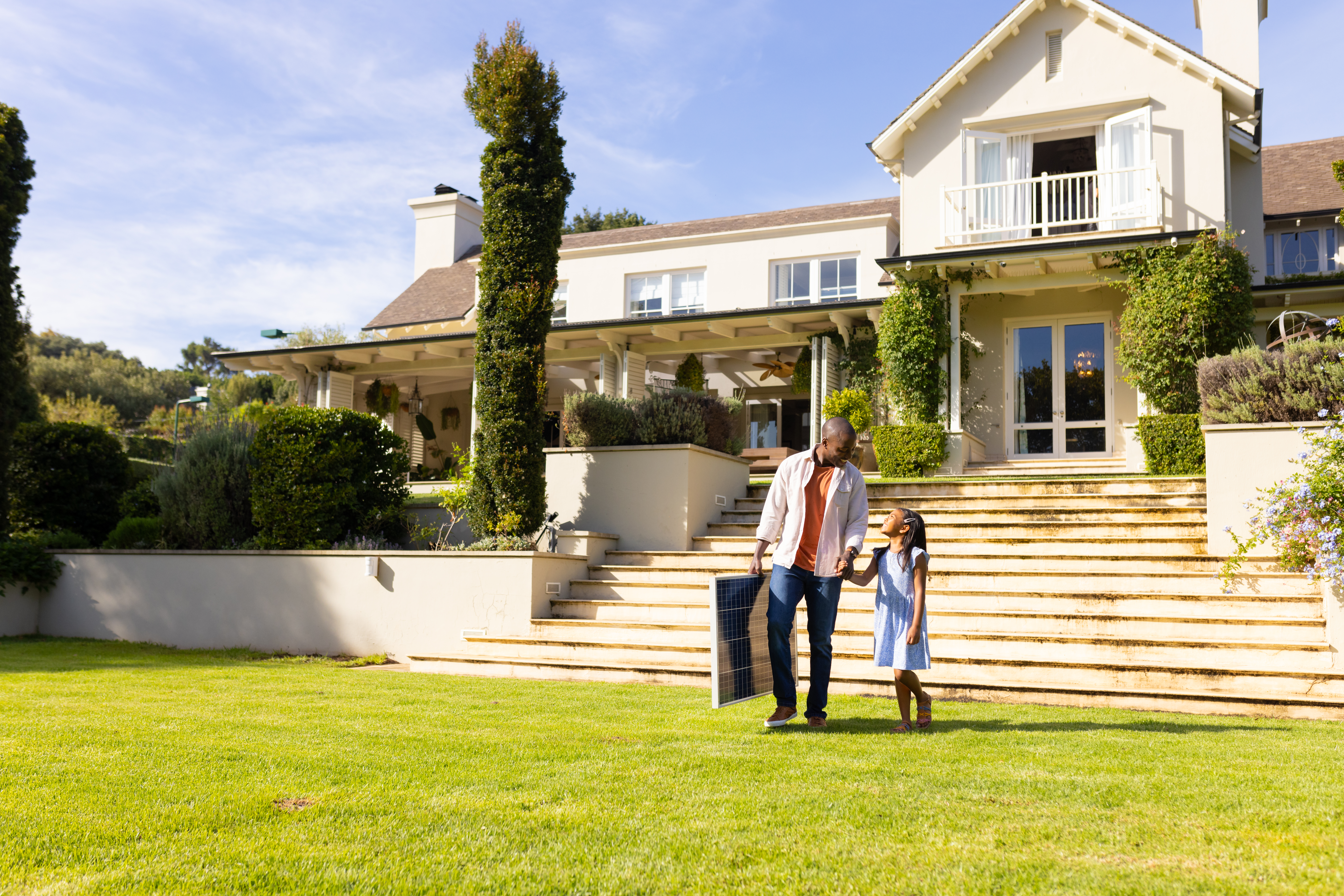 Father and daughter walking outside a luxury home with a “Download Sellers Guide” button displayed, promoting a complete home selling guide.
